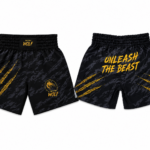 Shorts Muay Thai The Thai Wolf | Unleash The Beast | Negro y Dorado | Sublimado